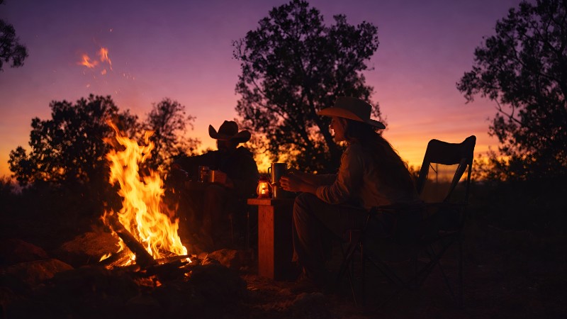Campfire tales under twilight sky